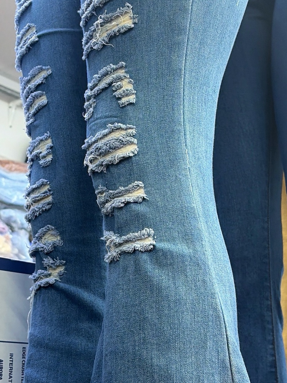 Distressed Light Blue Flare Jeans with Ripped Detail